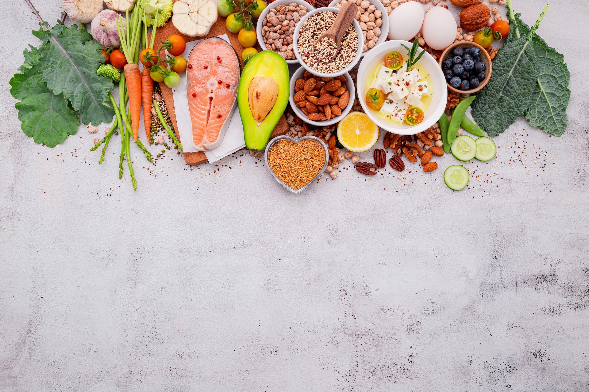 Ketogenic low carbs diet concept. Ingredients for healthy foods selection set up on white concrete background.